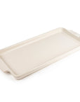 A white ceramic appetizer platter on a white background.