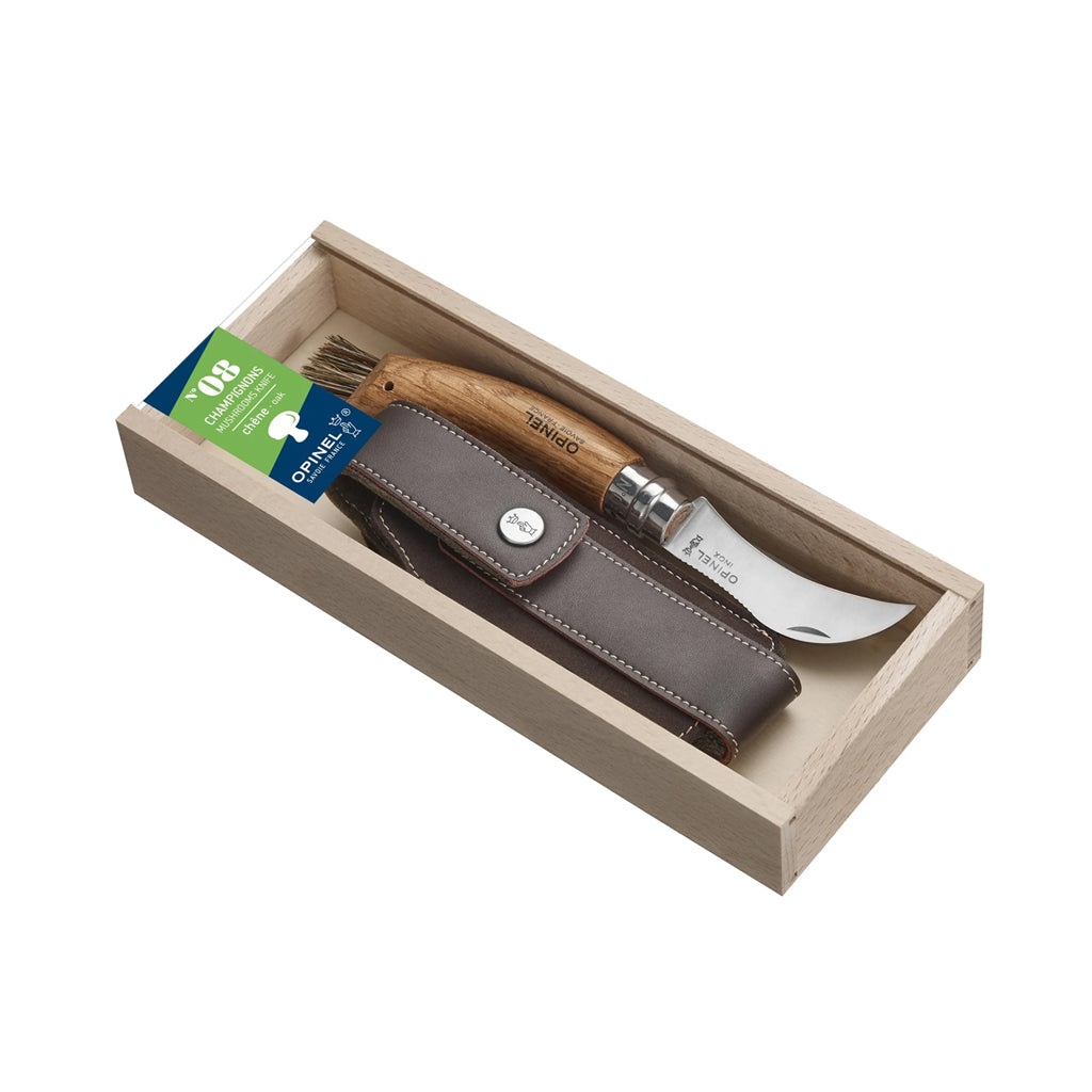 Opinel Mushroom Knife with an oak handle in a wooden box with a white background.